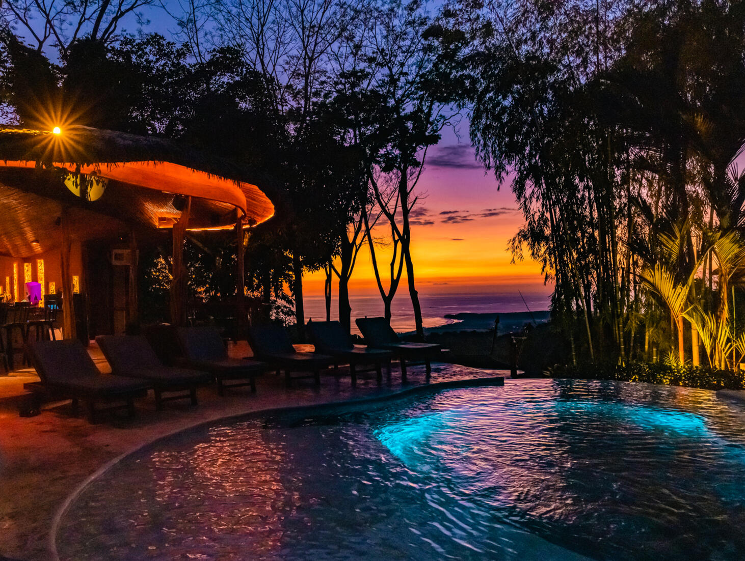 pool overlooking beach sunset